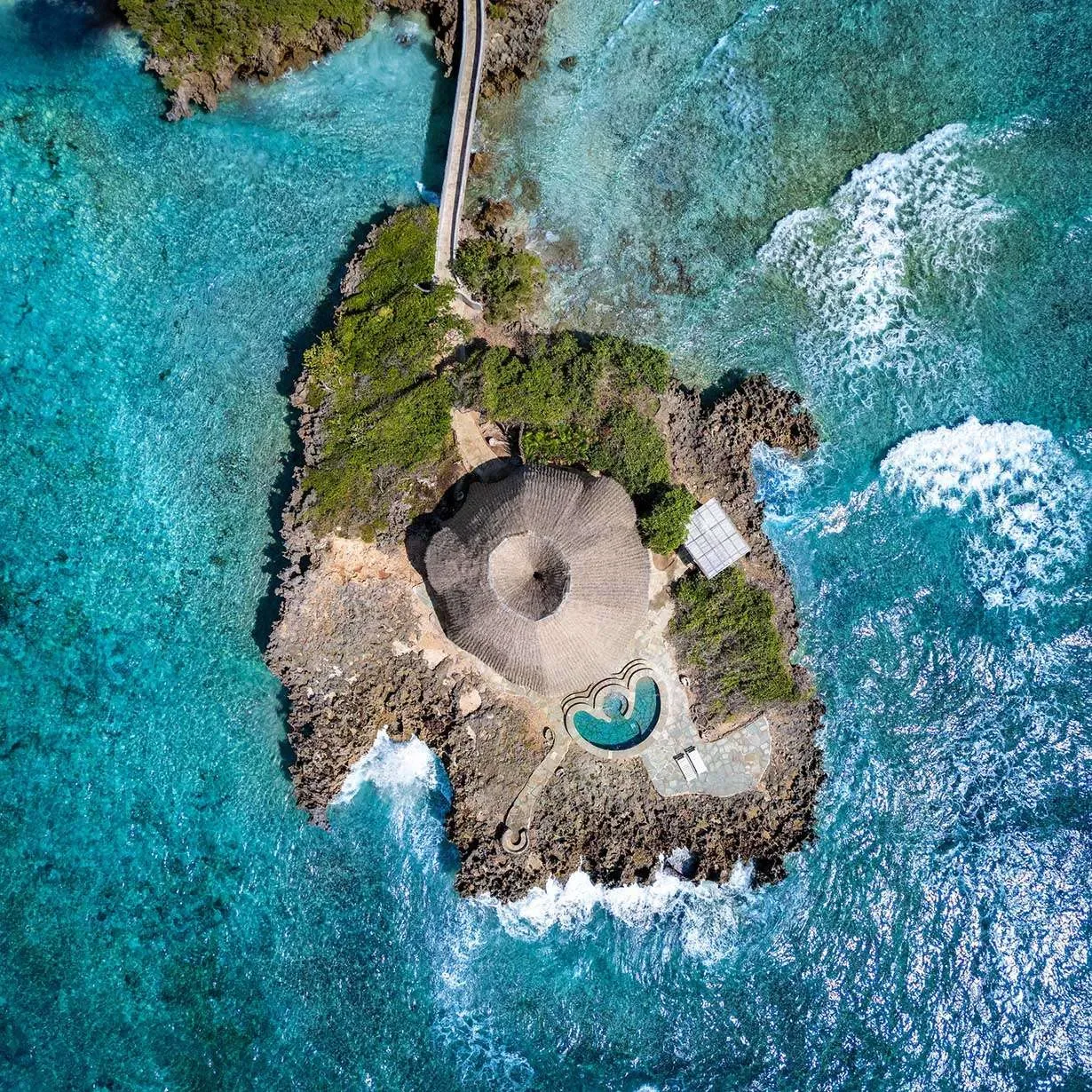 Aerial view of Chale Island surrounded by turquoise Indian Ocean water