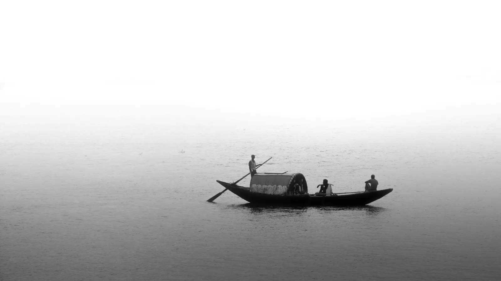 Small traditional boat crossing calm Indian Ocean water