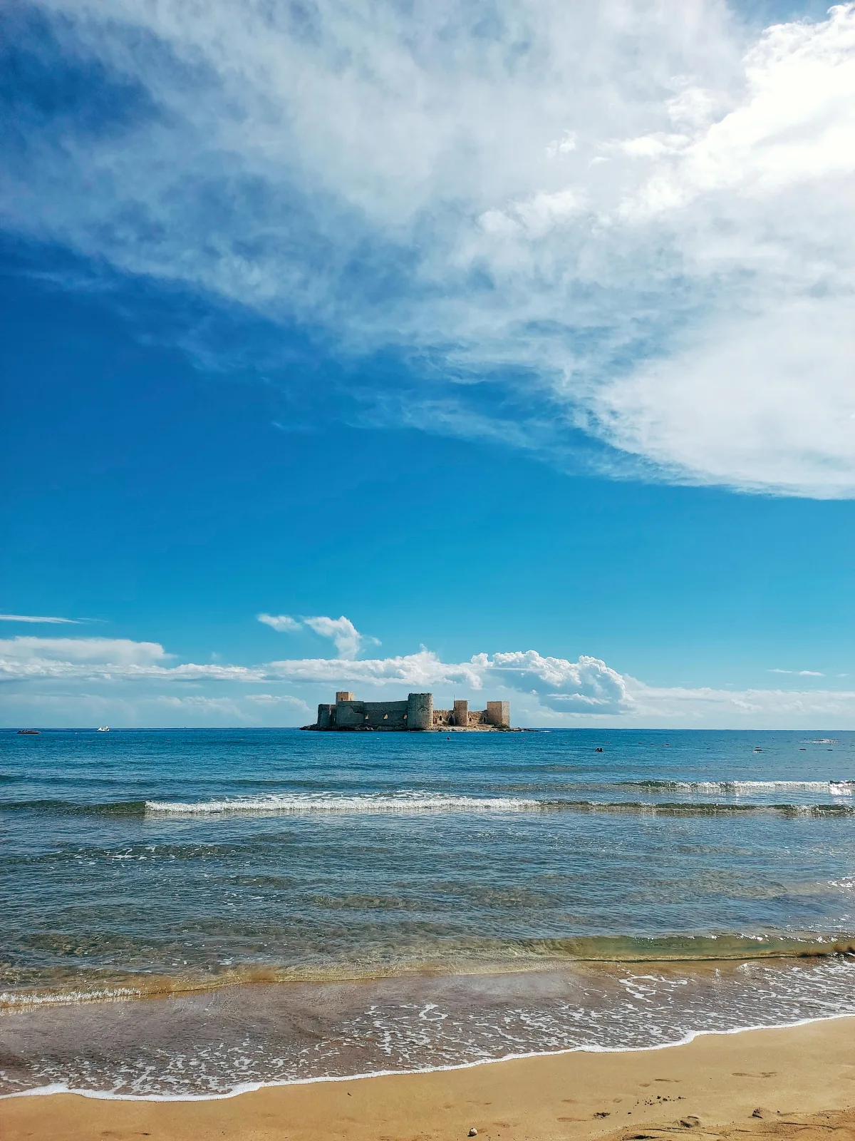 Historic coastal walls overlooking the blue Indian Ocean in Mombasa